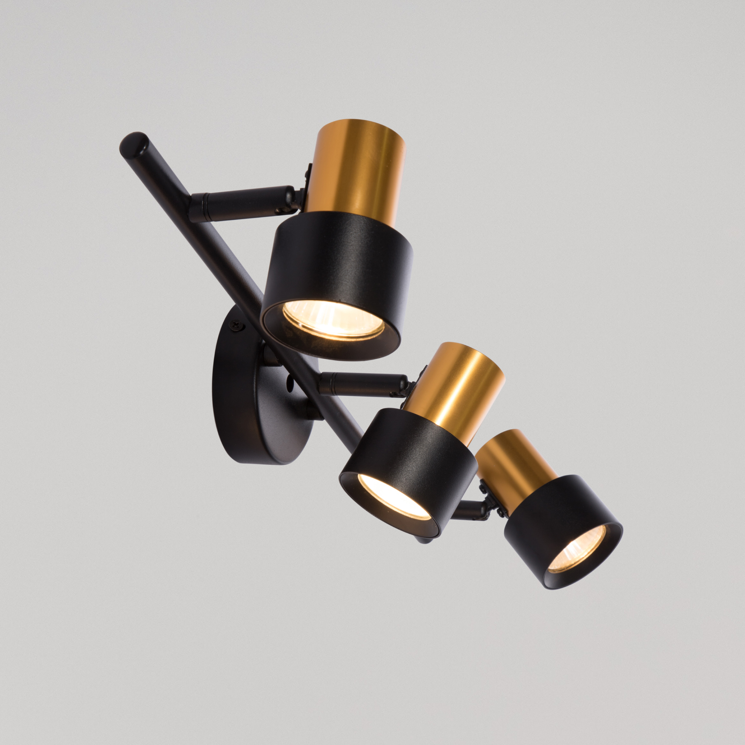 black and gold wall light with three head of gu10 sectors