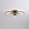 ceiling light features sleek and modern design with a unique circular arrangement of illuminated rings