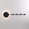 Abstract wall-mounted light fixture with geometric shapes and brass accents