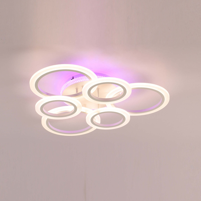 A modern, minimalist ceiling light fixture with three circular LED panels in a white finish.