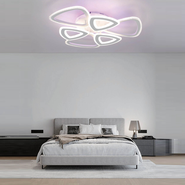 Minimalist, contemporary ceiling light fixture featuring a sleek, modern design.