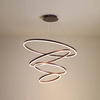 Contemporary spherical semi-flush mount fixture with frosted glass panels and warm white illumination for high ceilings