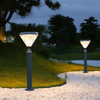 diamond shape unique solar powered bollard light installed on a sandy path