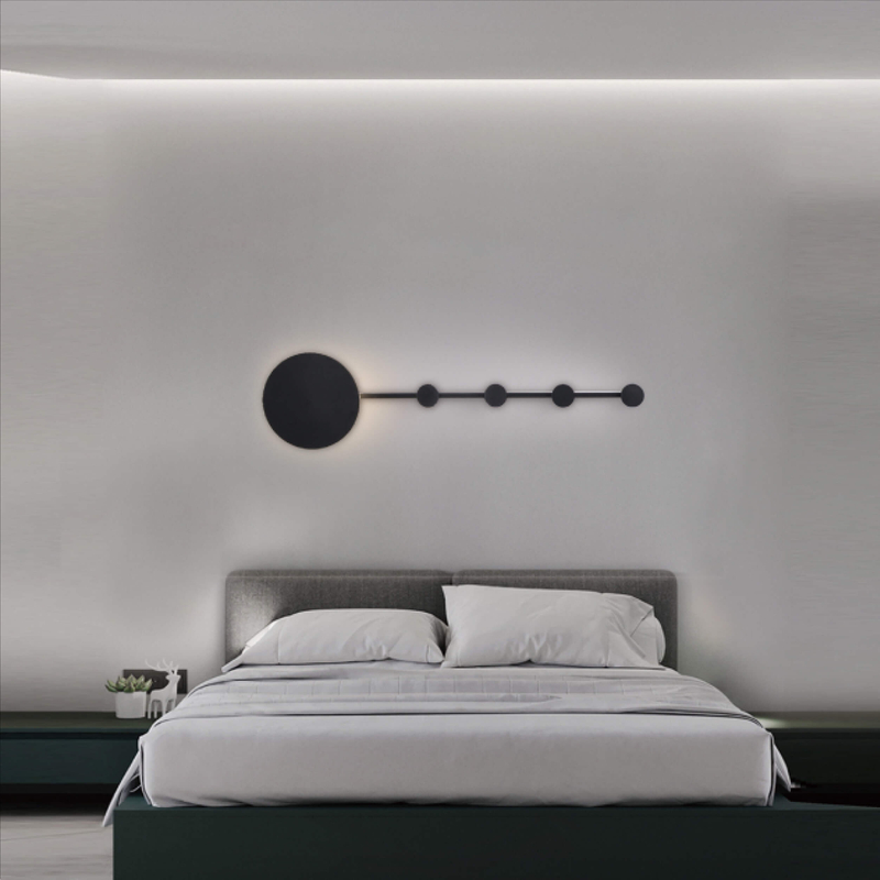 Minimalist modern wall sconce with circular and semicircular elements