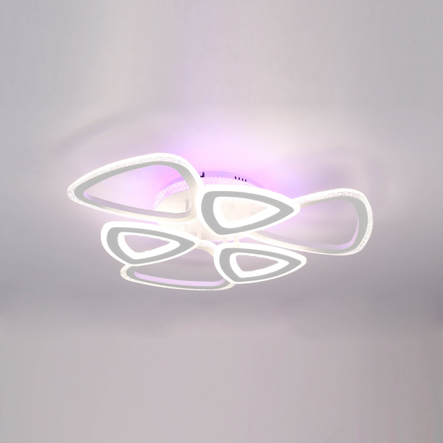Abstract geometric ceiling light with interconnected triangular shapes emitting a soft, diffused glow.