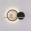 Stylized wall light fixture combining simple forms in a harmonious arrangement